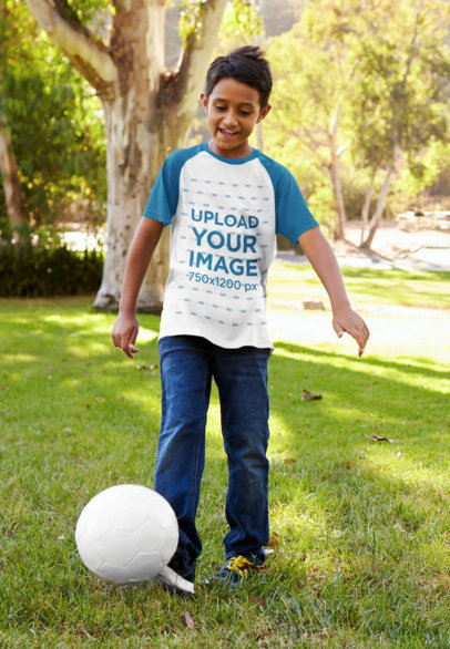Raglan Tee Mockup Featuring a Kid Playing with a Soccer Ball 39392-r-el2