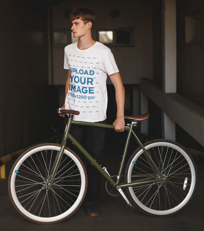 T-Shirt Mockup of a Man Holding a Fixie Bike 37799-r-el2