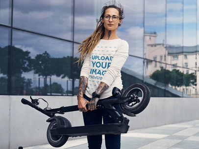 Long Sleeve Tee Mockup of a Woman Carrying Her Folding Scooter