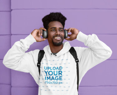 Hoodie Mockup of a Young Man Listening to Music