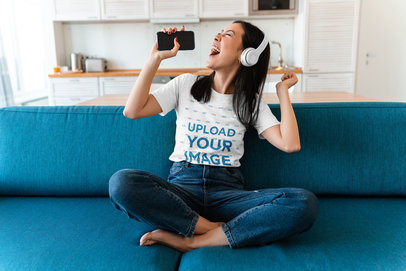 T-Shirt Mockup of a Young Woman Singing at Home