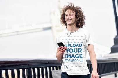T-Shirt Mockup of a Man with Long Curly Hair Walking on the Street 