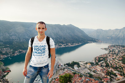 Sublimated V-Neck T-Shirt Mockup of a Traveler with a City's Landscape