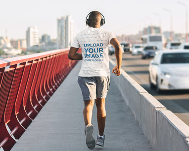 T-Shirt Mockup of an Athletic Man Running Away from the Camera