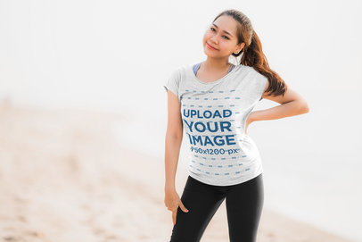 T-Shirt Mockup of a Smiling Woman Posing