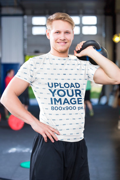 Sublimated Tee Mockup of a Happy Man Lifting Weights at the Gym