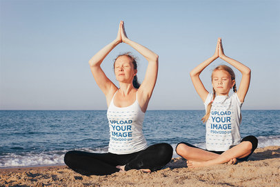 Tank Top and T-Shirt Mockup Featuring a Mother and Daughter Meditating at the Beach 