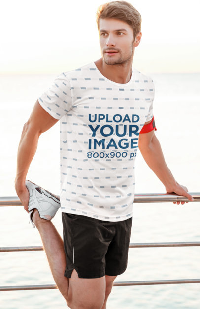 Mockup of a Man With a Sublimated T-Shirt Stretching to Run 