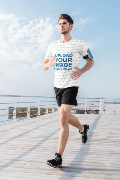 Sublimated T-Shirt Mockup of a Man Running on a Pier