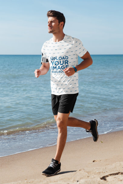 Sublimated T-Shirt Mockup of a Man Running at the Beach