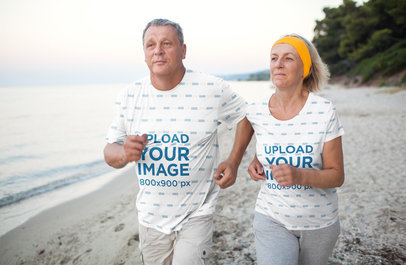 Activewear T-Shirt Mockup of a Senior Couple Running on the Beach