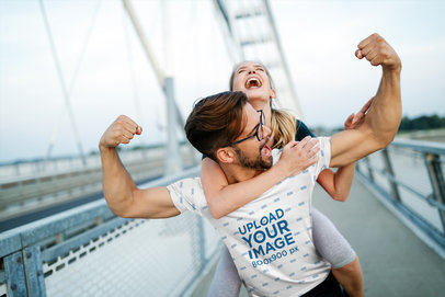 Mockup of a Muscular Man in a Sublimated T-Shirt Carrying His Girlfriend 39790-r-el2