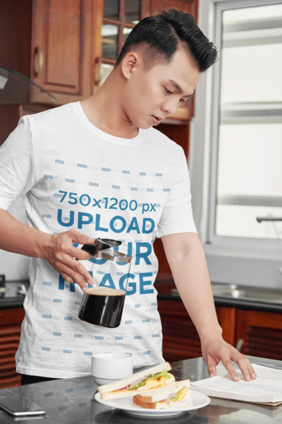 T-Shirt Mockup of a Man Studying While Having Breakfast
