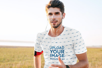 Sublimated Tee Mockup of a Man Running with Headphones