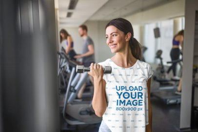 Mockup of a Woman Wearing a Sublimated T-Shirt at the Gym