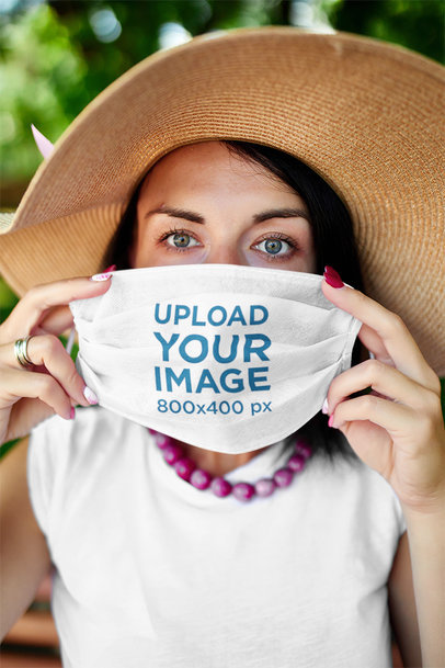 Mockup of a Stylish Woman Holding a Face Mask 40069-r-el2