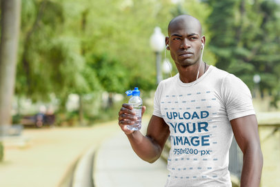 T-Shirt Mockup Featuring a Male Athlete Drinking Water
