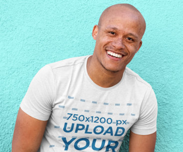 Mockup of a Joyful Man Wearing a Customizable Heather T-Shirt 