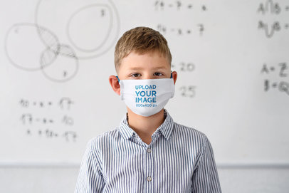 Face Mask Mockup of a Boy Standing in Front of a Whiteboard 