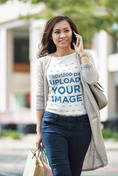 Tee Mockup of a Woman Talking on the Phone 