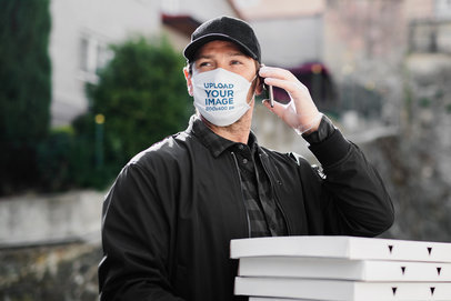 Face Mask Mockup Featuring a Delivery Man on the Phone 