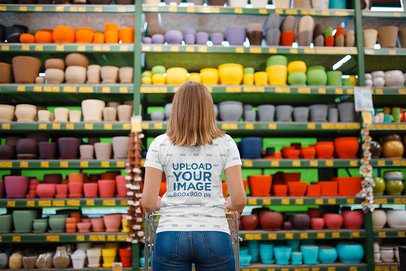 Back View Mockup of a Woman Wearing a Sublimated Tee at a Store 34893-r-el2