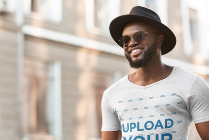 Heather T-Shirt Mockup of a Man Wearing a Fedora Hat