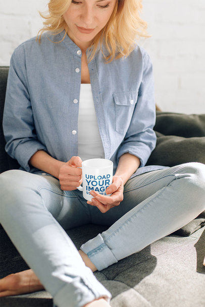 Mockup of a Woman in the Living Room Holding an 11 oz Coffee Mug 