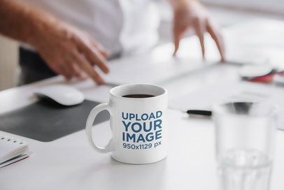 Mockup of an 11 oz Coffee Mug on an Office's Desk