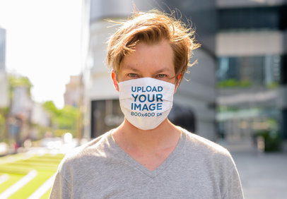  Mockup of a Young Man Wearing a Sublimated Face Mask 