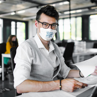 Face Mask Mockup of a Man Working in an Office