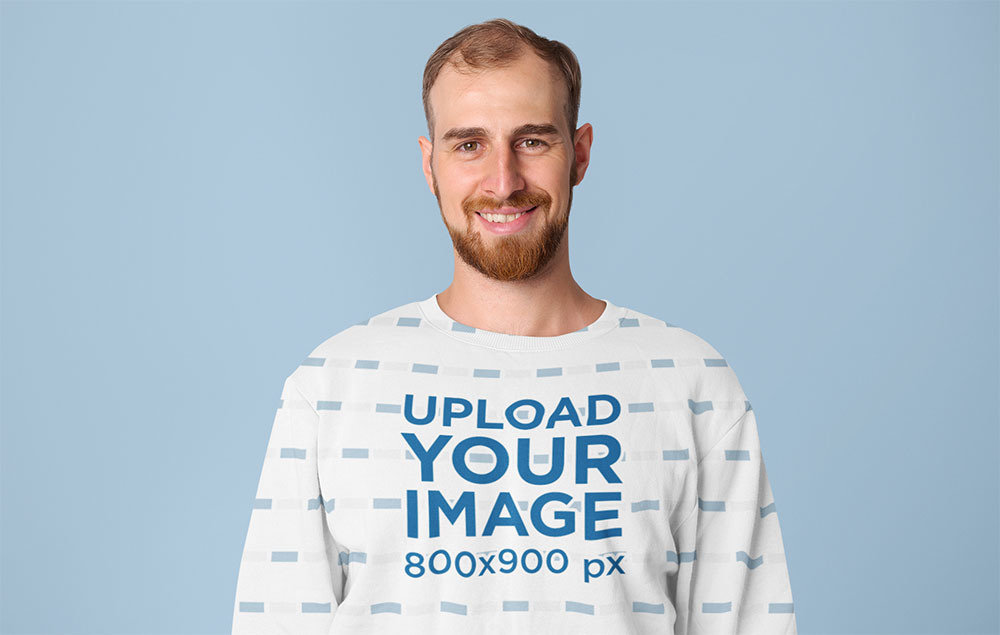Sublimated Sweatshirt Mockup Featuring a Smiling Man in a Studio
