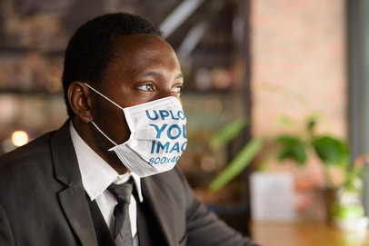 Mockup Featuring a Man in a Suit Wearing a Face Mask 