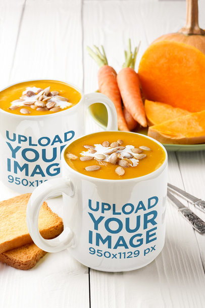 Mockup of Two Large Coffee Mugs Placed Next to Some Carrots 36059-r-el2