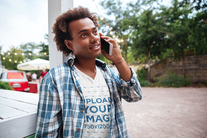 V-Neck T-Shirt Mockup of a Man on the Phone