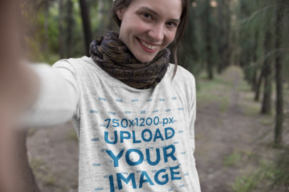Heather Long-Sleeve Tee Mockup of a Woman Taking a Selfie in the Forest
