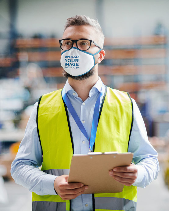 Face Mask Mockup Featuring a Man with Glasses Working