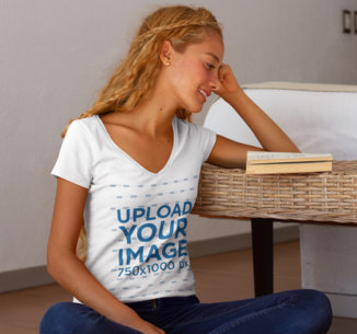 V-Neck T-Shirt Mockup of a Woman Reading at Home