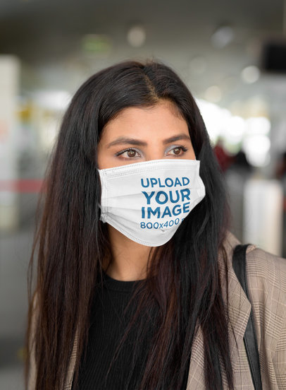 Mockup of a Woman Protecting Herself with a Face Mask
