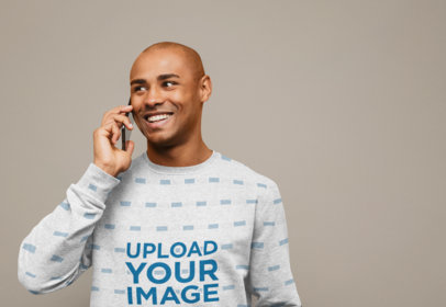 Sublimated Sweatshirt Mockup of a Joyful Man Talking on the Phone 
