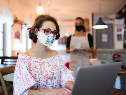Face Mask Mockup of a Woman Working at a Coffee Shop