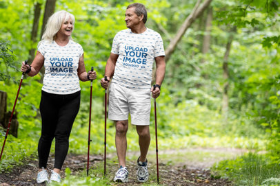 Sublimated T-Shirt Mockup Featuring a Senior Couple Hiking 
