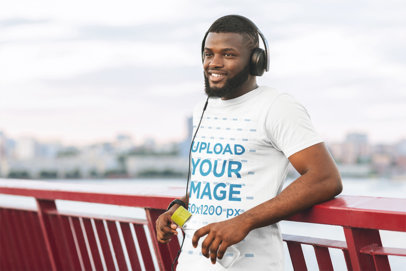T-Shirt Mockup of a Happy Man Taking a Break From Running 