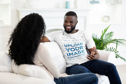 T-Shirt Mockup of a Happy Man Talking With His Girlfriend at Home 