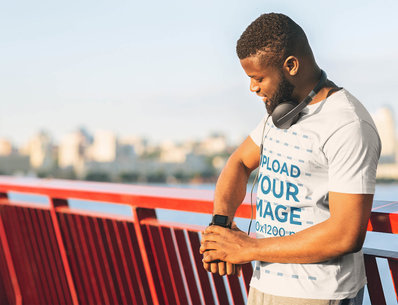 T-Shirt Mockup of a Man Checking His Smartwatch 