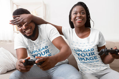 T-Shirt Mockup of a Woman Playing Video Games with Her Boyfriend
