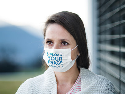 Mockup Featuring a Long-Haired Woman Wearing a Sublimated Face Mask 