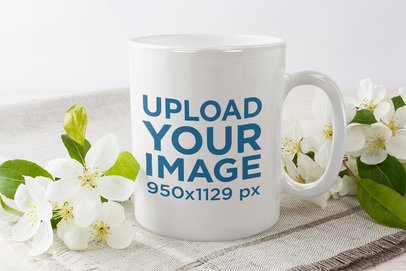 Mockup of an 11 oz Coffee Mug Surrounded by Delicate Flowers 