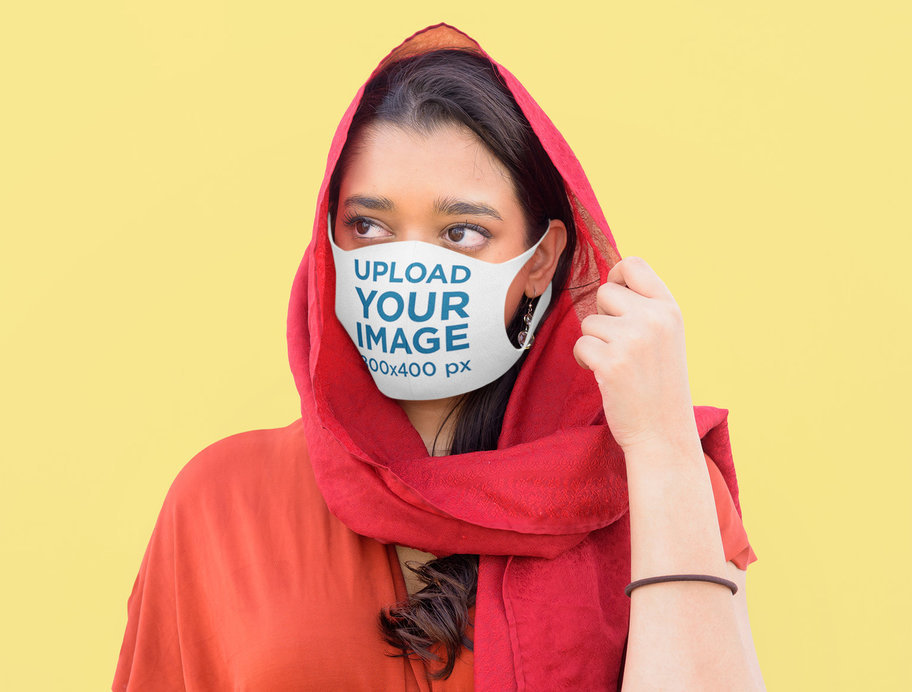 Mockup of a Woman Using a Face Mask at a Studio