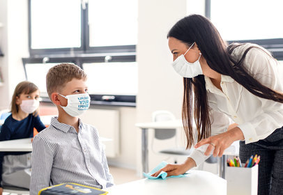 Face Mask Mockup Featuring a Boy and a Teacher at School 